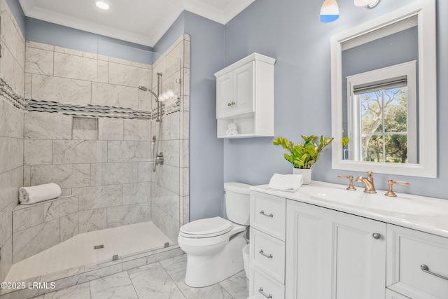 full bath featuring marble finish floor, toilet, ornamental molding, vanity, and tiled shower