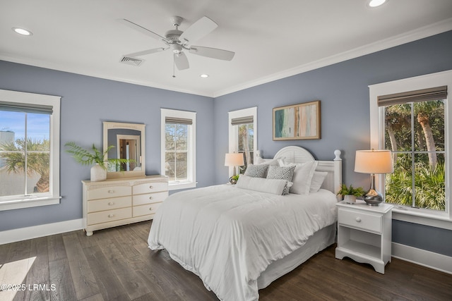 bedroom featuring ornamental molding, multiple windows, baseboards, and dark wood-style floors