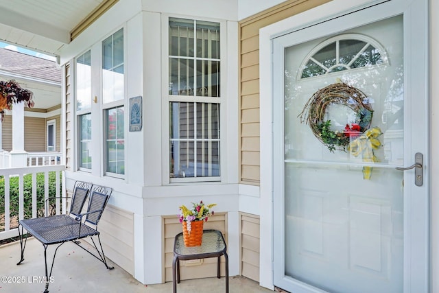 property entrance featuring covered porch