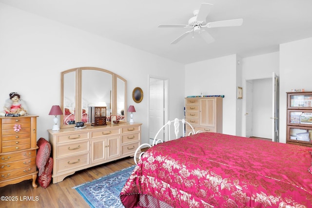 bedroom featuring ceiling fan and wood finished floors