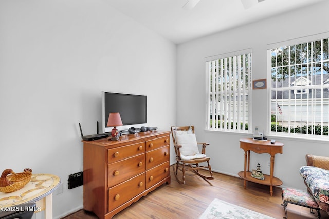 living area with a wealth of natural light and wood finished floors