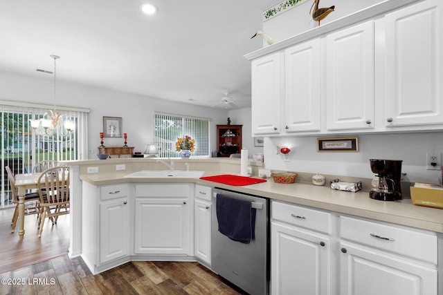 kitchen featuring wood finished floors, a peninsula, a sink, light countertops, and dishwasher