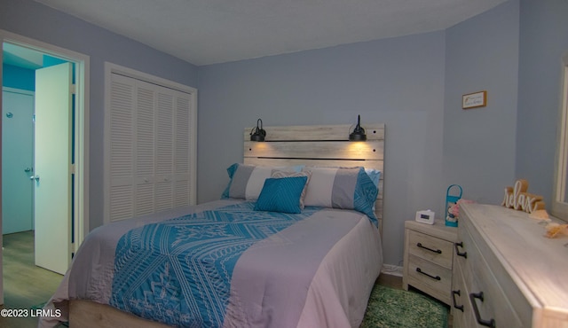 carpeted bedroom with a closet