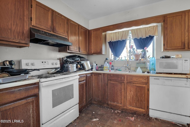 kitchen featuring sink and white appliances