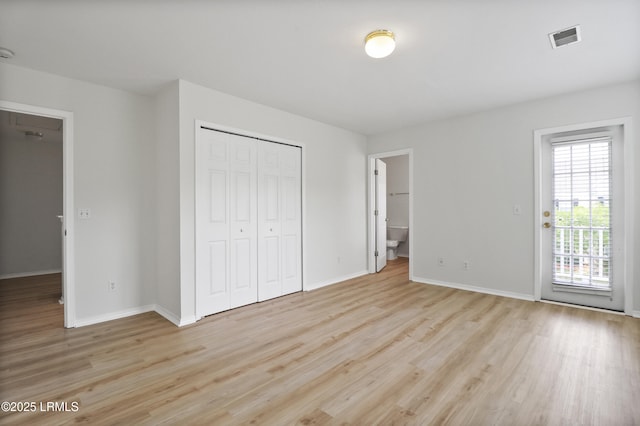 300 Campus Ln, Okatie, SC 29909 - unfurnished bedroom with light wood-type flooring, baseboards, and a closet