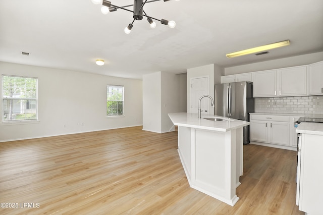 300 Campus Ln, Okatie, SC 29909 - kitchen featuring a sink, healthy amount of natural light, backsplash, and light countertops