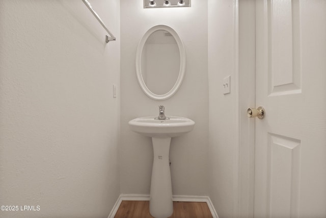300 Campus Ln, Okatie, SC 29909 - bathroom featuring baseboards and wood finished floors