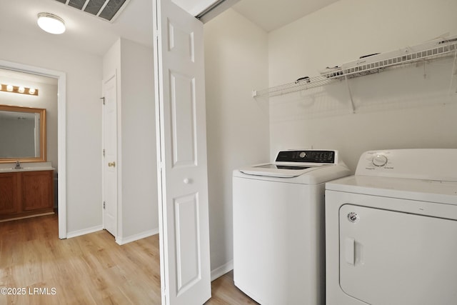 300 Campus Ln, Okatie, SC 29909 - washroom with washer and dryer, light wood-type flooring, and baseboards