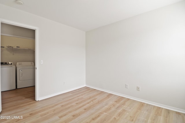 300 Campus Ln, Okatie, SC 29909 - spare room featuring washing machine and clothes dryer, light wood-style floors, and baseboards