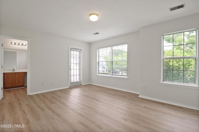 300 Campus Ln, Okatie, SC 29909 - unfurnished room featuring light wood-type flooring, baseboards, and a sink
