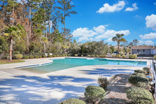 300 Campus Ln, Okatie, SC 29909 - community pool featuring a patio and view of wooded area