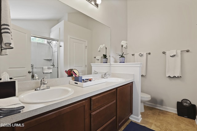 2110 River Rock Way, Beaufort, SC 29902 - bathroom with double vanity, a shower stall, tile patterned flooring, and lofted ceiling