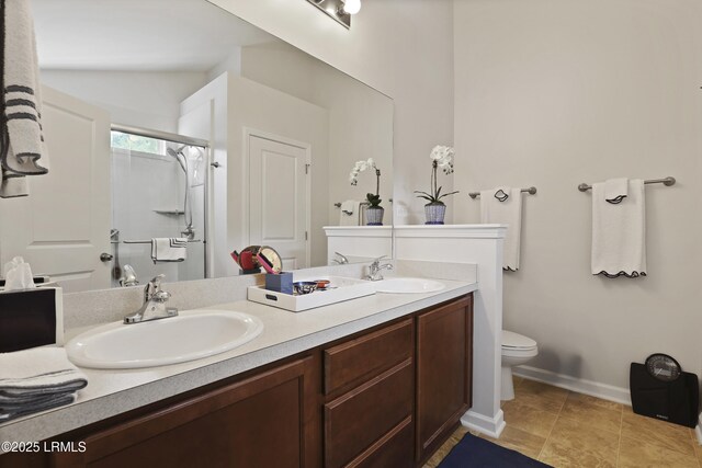 2110 River Rock Way, Beaufort, SC 29902 - bathroom with double vanity, a shower stall, tile patterned flooring, and lofted ceiling