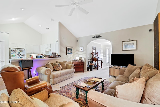 living room featuring high vaulted ceiling and ceiling fan