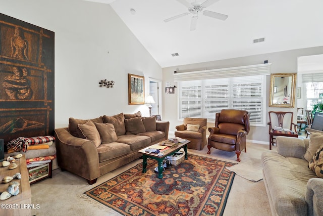 carpeted living room featuring high vaulted ceiling and ceiling fan