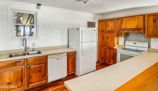 kitchen with crown molding, sink, white appliances, and dark hardwood / wood-style flooring