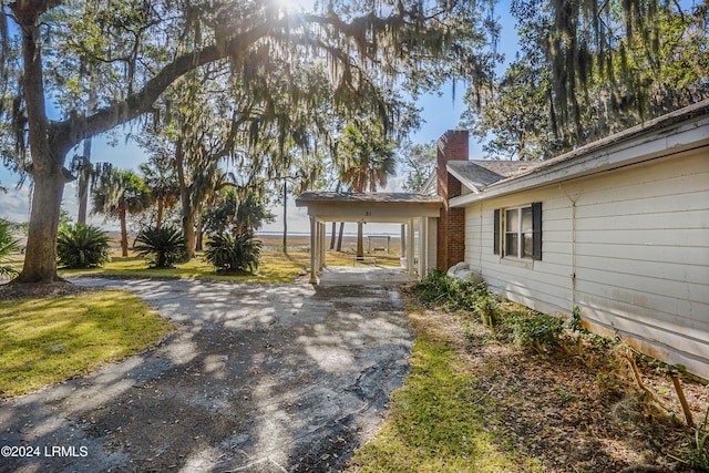 view of yard featuring a carport