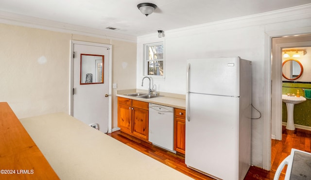 kitchen with sink, crown molding, fridge, dark hardwood / wood-style floors, and white dishwasher