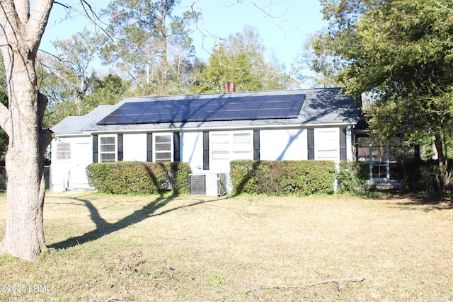 view of outdoor structure featuring solar panels