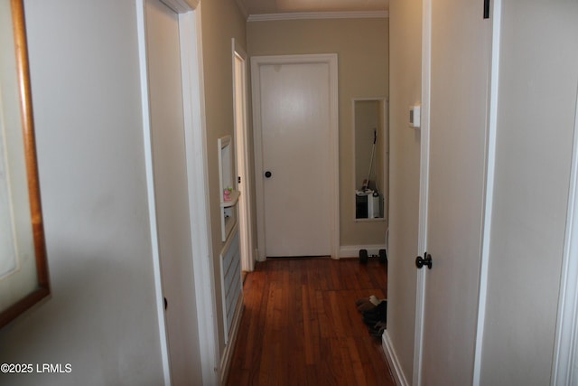 hallway featuring dark wood-style floors and crown molding