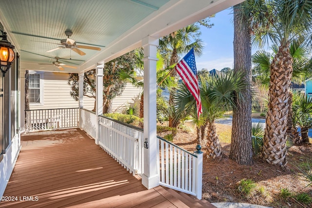 wooden terrace featuring a porch and ceiling fan