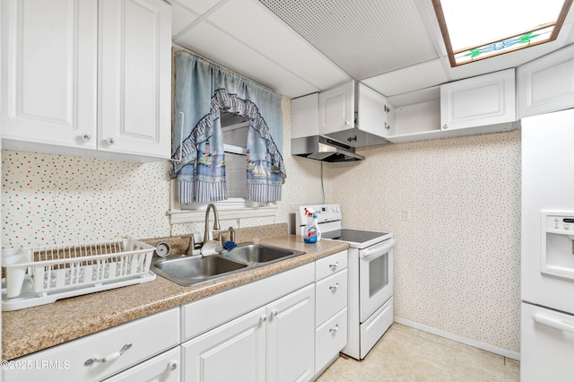 kitchen featuring white cabinetry, sink, and white appliances