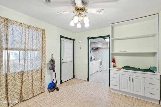 kitchen featuring ceiling fan, white cabinets, and white range with electric stovetop