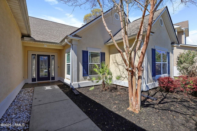 12 Elloree Way, Bluffton, SC 29910 - property entrance featuring stucco siding and a shingled roof