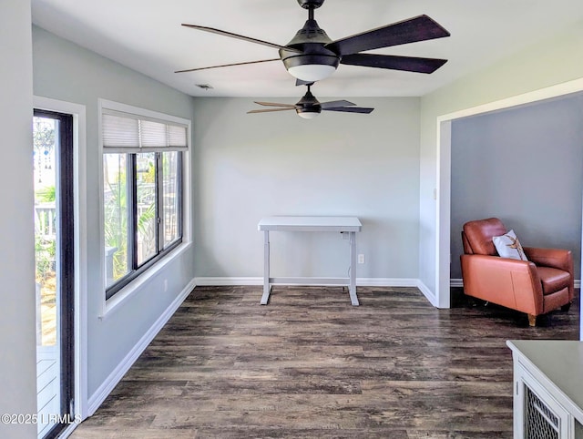 dining room with wood finished floors, ceiling fan, and baseboards