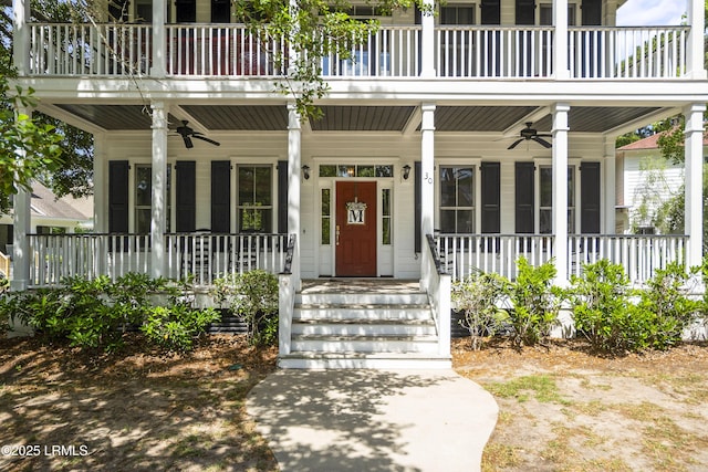 property entrance with a porch, a ceiling fan, and a balcony