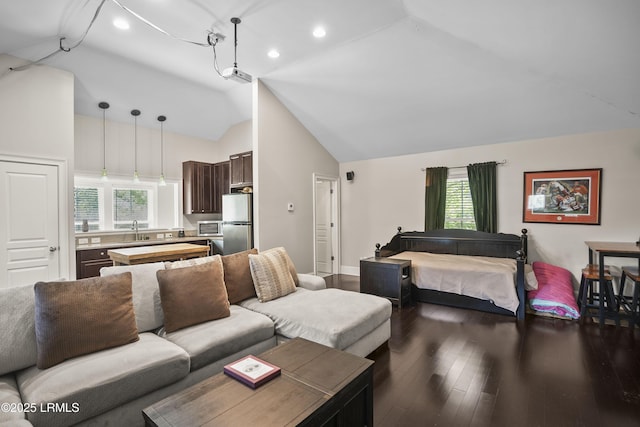 living room featuring recessed lighting, dark wood finished floors, a healthy amount of sunlight, and high vaulted ceiling