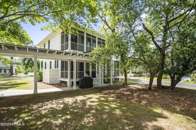 rear view of house with a sunroom