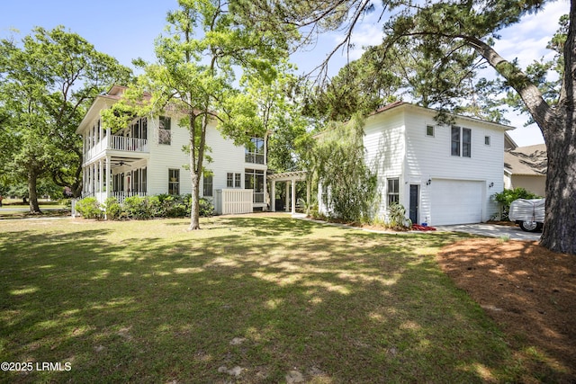 view of front of property featuring an attached garage and a front lawn