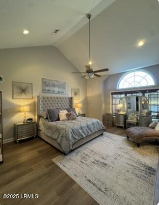 bedroom featuring lofted ceiling and wood finished floors