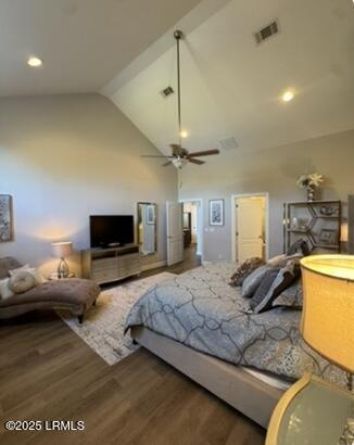 bedroom featuring high vaulted ceiling, a ceiling fan, visible vents, and wood finished floors