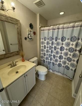 bathroom with visible vents, toilet, a shower with curtain, tile patterned flooring, and vanity