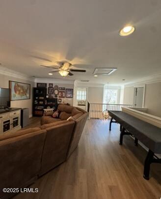 game room featuring recessed lighting, wood finished floors, and crown molding