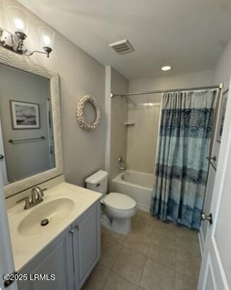 full bathroom featuring shower / tub combo with curtain, visible vents, toilet, vanity, and tile patterned floors