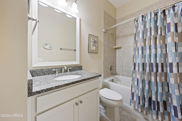 full bathroom featuring tile patterned floors, toilet, vanity, and shower / bath combo