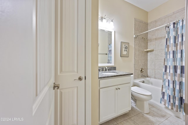 full bathroom with tile patterned floors, toilet, shower / tub combo, and vanity