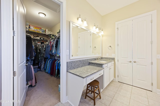 bathroom featuring tile patterned flooring and vanity