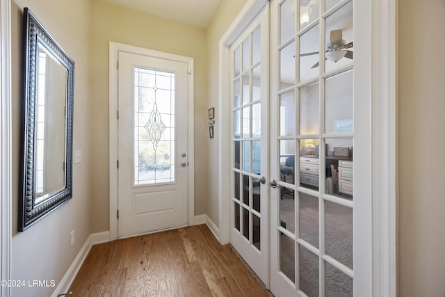 entryway with french doors and wood-type flooring