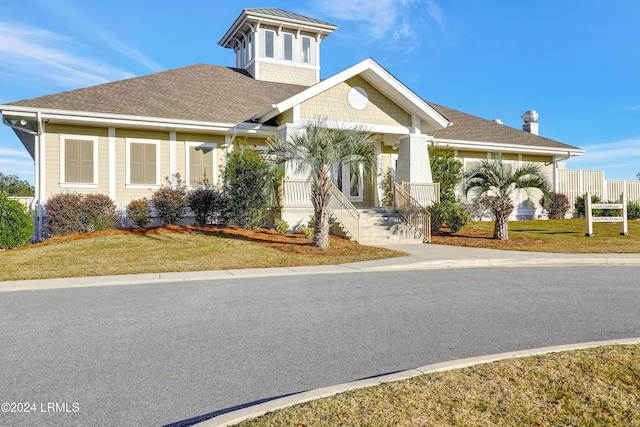 view of front of home with a front lawn and a porch