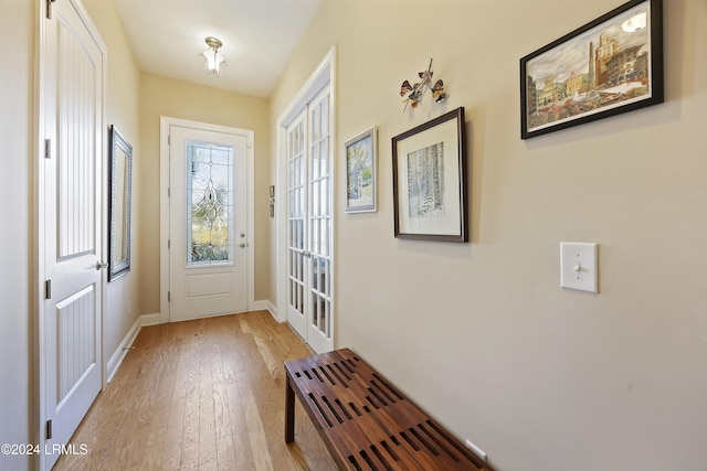 doorway with light wood-type flooring