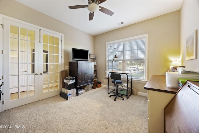 office area featuring light carpet, ceiling fan, and french doors