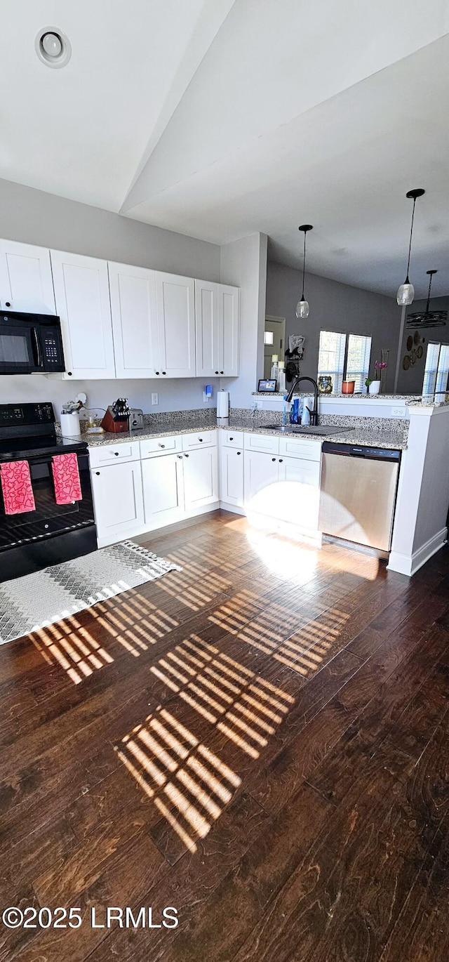 kitchen featuring black appliances, dark hardwood / wood-style floors, kitchen peninsula, pendant lighting, and white cabinets