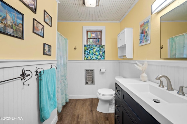 20 Trout St, Bluffton, SC 29910 - bathroom with vanity, ornamental molding, wainscoting, and wood finished floors