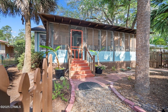 20 Trout St, Bluffton, SC 29910 - view of front facade with a sunroom and fence