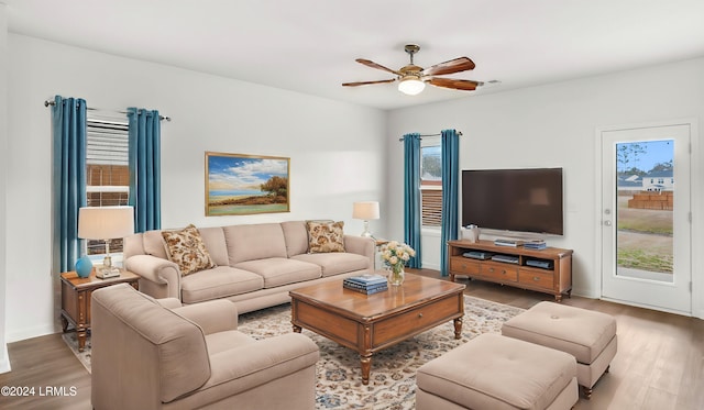 living room with hardwood / wood-style floors and ceiling fan