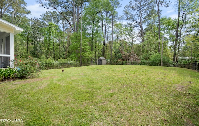 3010 Palmetto Ridge St, Beaufort, SC 29906 - view of yard featuring a sunroom, a storage shed, an outdoor structure, and fence